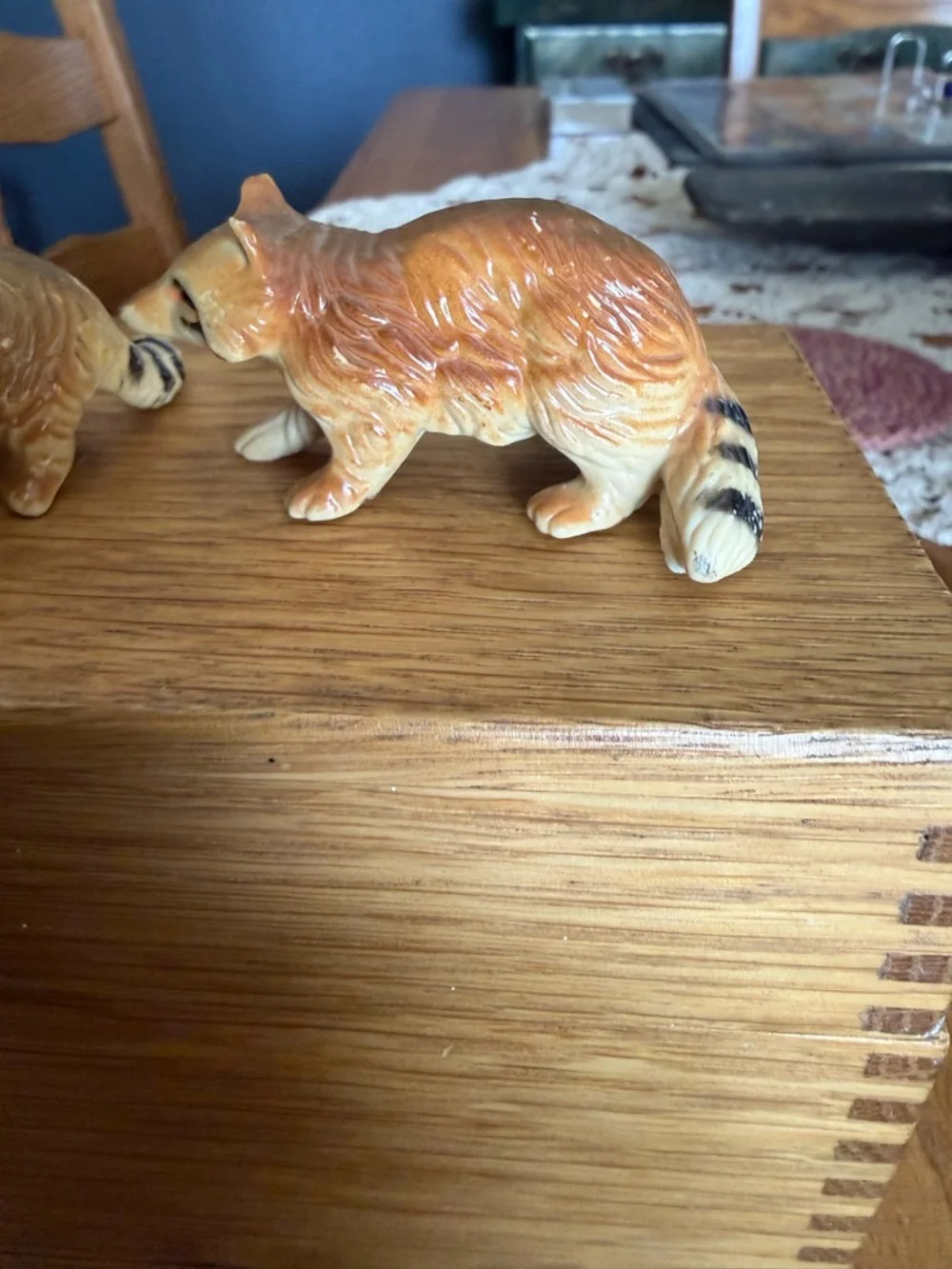 Mini pair of raccoon figurines